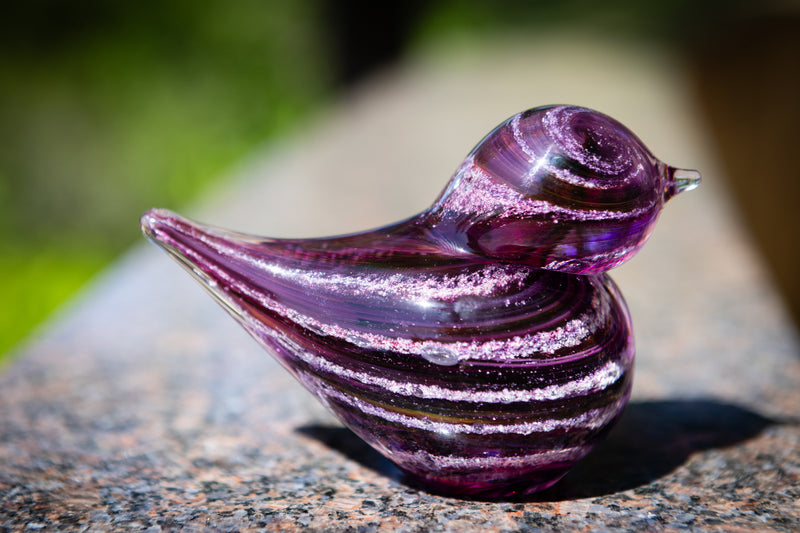 glass bird with cremation ash
